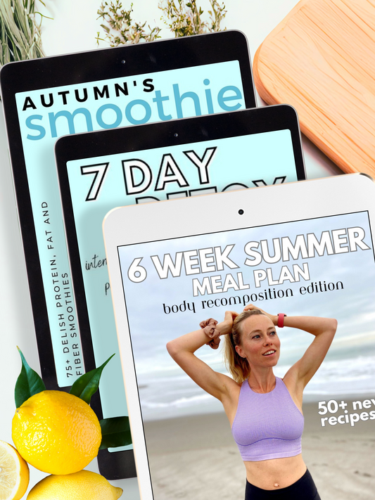 Three tablets displaying the fat loss bundle including Autumn's Smoothie Cookbook, 7 Day Detox, and The Body Recomposition Meal Plan with a lemon and wooden cutting board in the background.