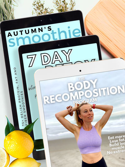 Three tablets displaying the fat loss bundle including Autumn's Smoothie Cookbook, 7 Day Detox, and The Body Recomposition Meal Plan with a lemon and wooden cutting board in the background.